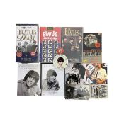 A collection of Beatles memorabilia, to include VHS tapes, CDs, pin badges, ABC Chewing gum cards