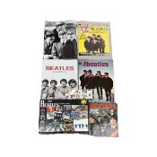 A mixed lot of Beatles memorabilia, to include poster books, calendar, jigsaw puzzle, Royal Mail