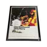 A large framed reproduction film poster for Dirty Harry, starring Clint Eastwood.Framed size