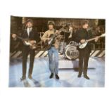 A collection of Beatles photographic and advertising posters