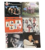 A mixed lot of signed 12'' vinyl LPs, to include: - The Barron Knights - Lenny Henry - Tom Waite -