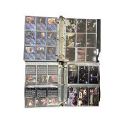 A large quantity of Topps collectable X Files trading cards in folios, to includ a card signed by