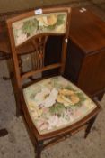 An Edwardian bedroom chair with floral upholstery