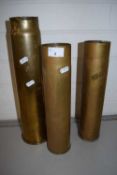 Three brass shell cases