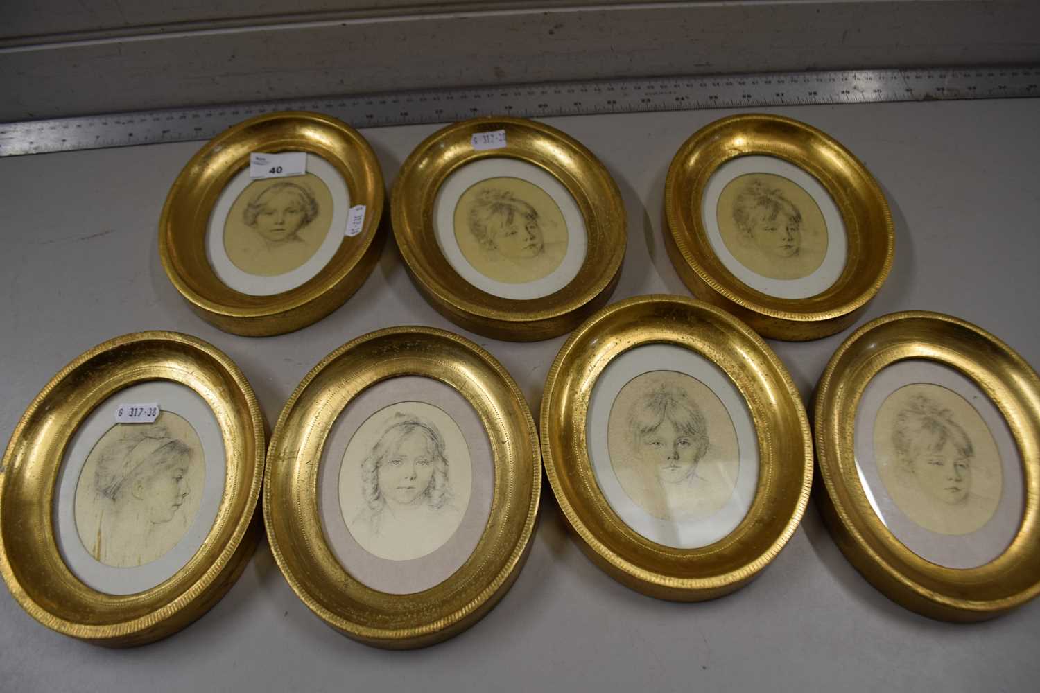 Group of seven small portraits in oval gilt frames bearing labels to back Rene David Florence