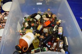 Box containing a collection of various miniature bottles of spirits and liqueurs