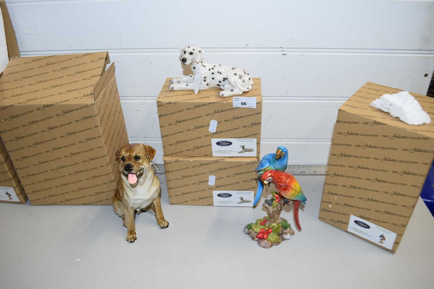 Five boxed Julianna Collection models, dogs and macaws