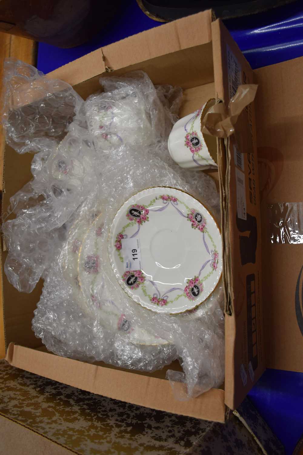 Quantity of rose and ribbon decorated porcelain tea ware