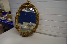 20th Century wall mirror in a gilt finish plaster frame