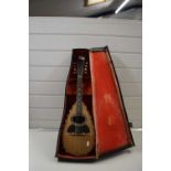 A cased Italian mandolin bearing label Il Globo