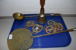 Mixed Lot: Various brass wares comprising a cream skimmer, ladle, horse brasses and a small bell