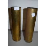 Two brass shell cases, 31cm high