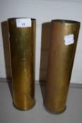 Two brass shell cases, 31cm high