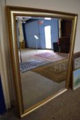 Large 20th Century bevelled wall mirror in gilt effect frame, 106 x 137cm