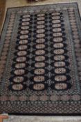 20th Century Middle Eastern rug decorated with lozenges on a blue background, 90 x 122cm