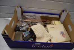 A box of various mixed items to include commemorative coins, opera glasses, loom shuttles, bridge