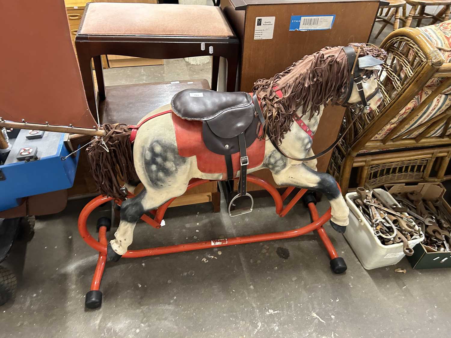 Retro rocking horse on metal stand