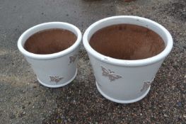 Two modern wood lodge glazed plant pots decorated with butterflies, largest 39cm diametre