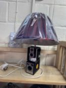 Upcycled table lamp formed from two vintage cameras