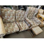 Early 20th Century suite of floral upholstered furniture comprising wing chair, two smaller chairs