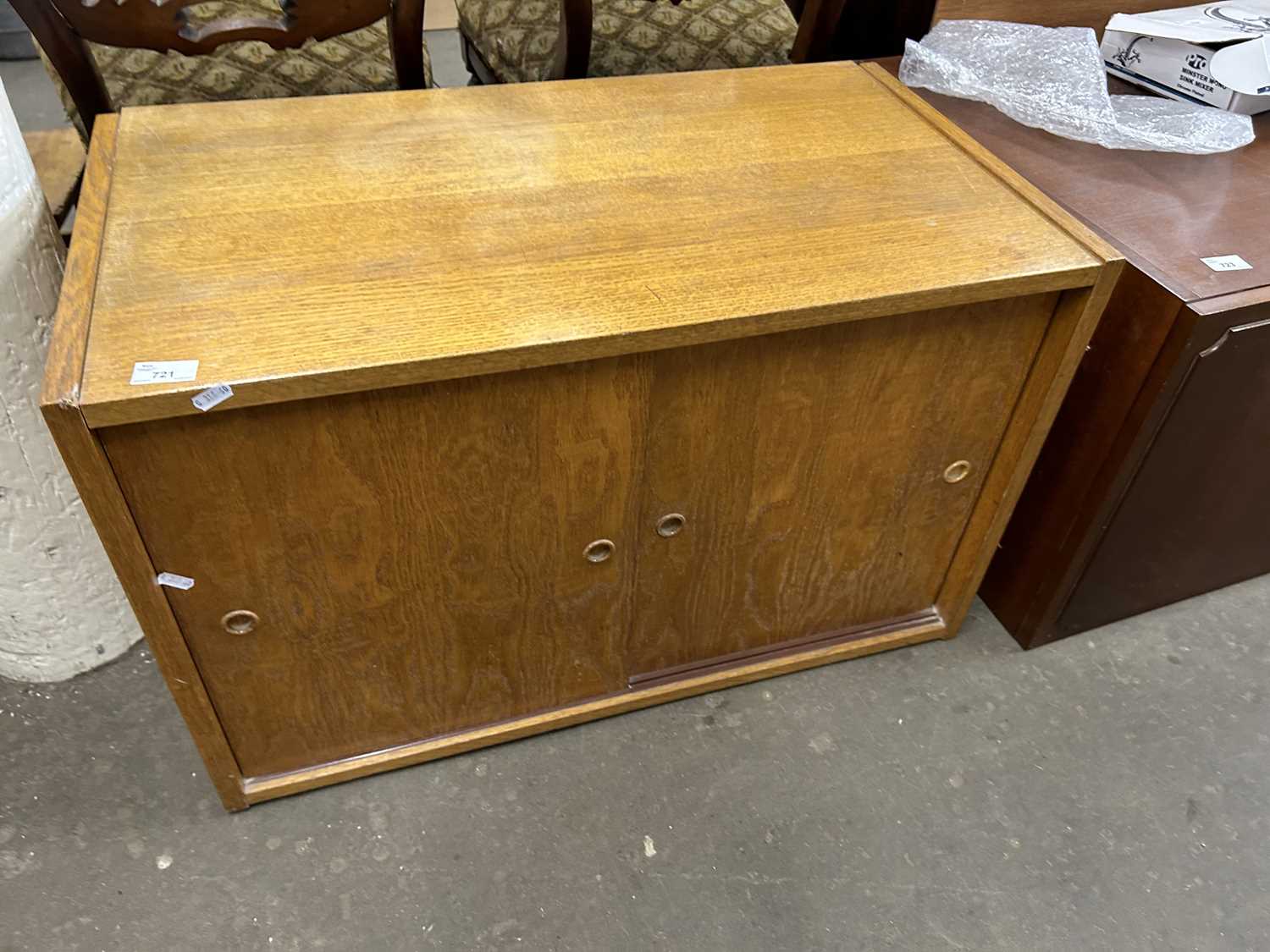 Mid Century oak veneered cabinet with two sliding doors