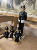 Royal Doulton British Policeman HN5365 together with a Royal Doulton Bunnykins Policeman and two