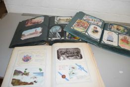 Three assorted postcard albums