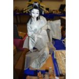 Model of a Geisha on wooden stand