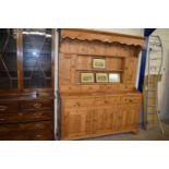 Pine kitchen cabinet with shelves above, drawers and cupboards below, 157cm wide