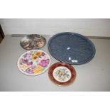 A pale blue Thai ceramic charger and three collectors plates