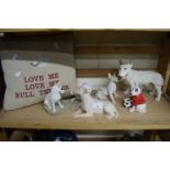 A quantity of Bull Terrier figurines together with a Bull Terrier cushion