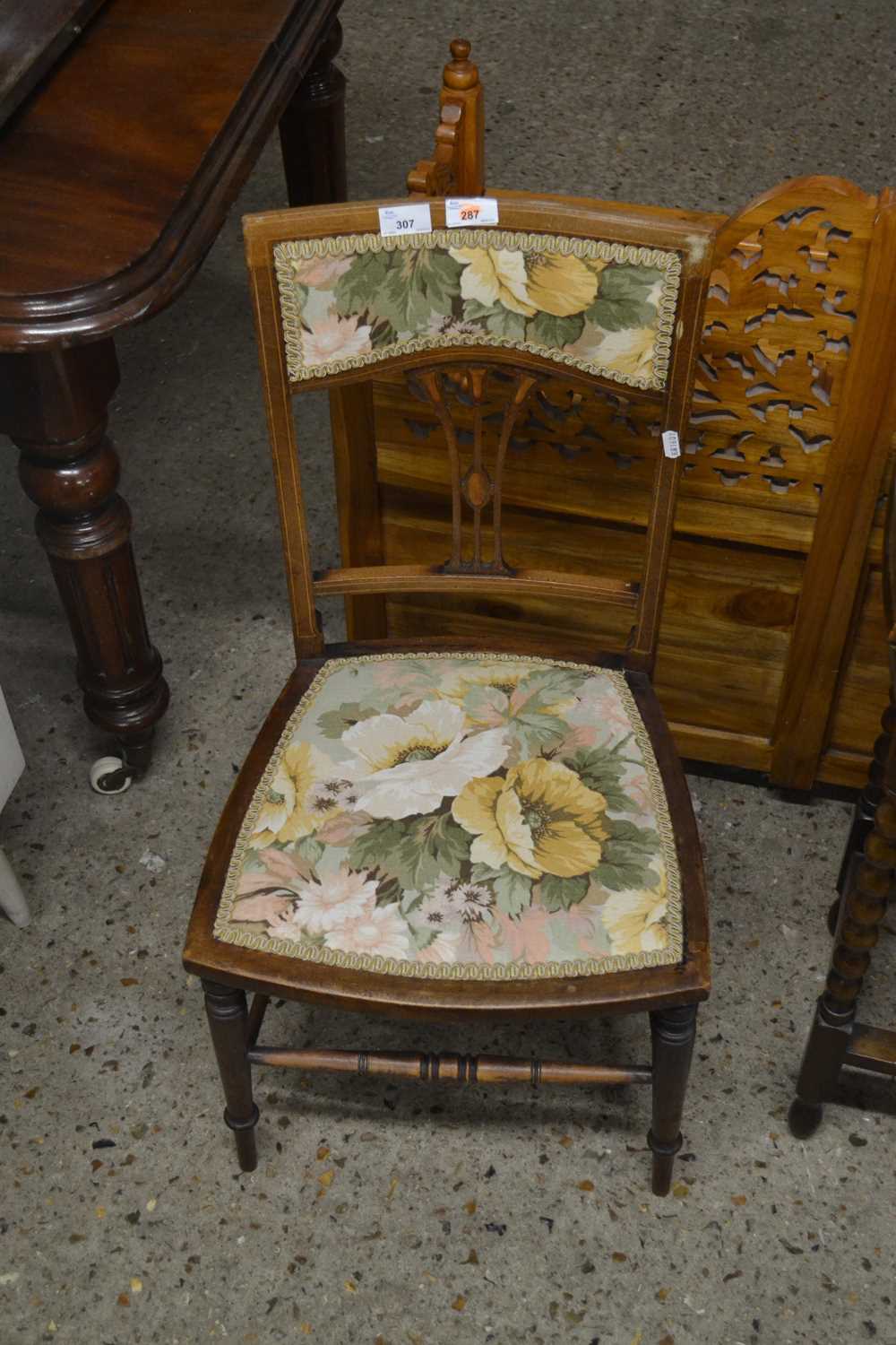 An Edwardian bedroom chair with floral upholstery