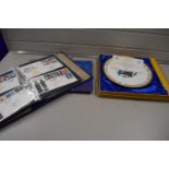 A album of first day covers together with a Churchill collectors plate and an album of commemorative