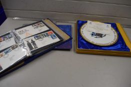 A album of first day covers together with a Churchill collectors plate and an album of commemorative