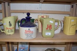 Seven assorted whisky jugs