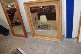 A pine framed wall mirror, 100cm high