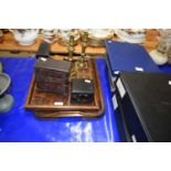 Two wooden trays, a pair of brass candlesticks and other items