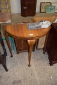 A 20th Century demi-lune hall table