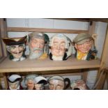 Four Royal Doulton character jugs to include Robinson Crusoe, The Lawyer, The Gardener and one