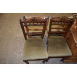 Set of four dining chairs with green seats and turned legs