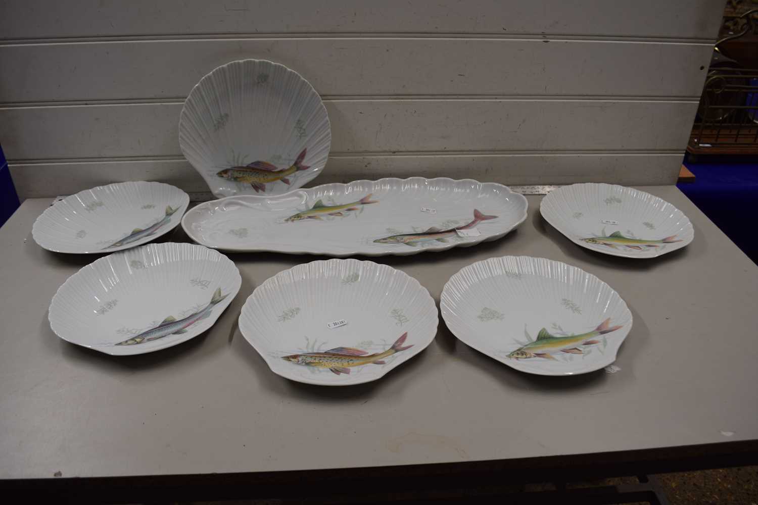 Set of Limoges fish plates and a fish platter