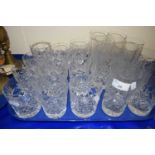 A quantity of cut glass drinking glasses to include high balls and tumblers