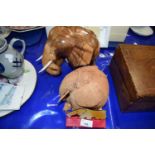 Carved wooden elephant, another carved coconut elephant and two others