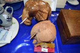 Carved wooden elephant, another carved coconut elephant and two others