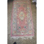 Modern pink ground rug, 121cm wide
