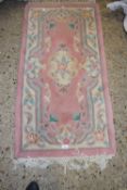 Modern pink ground rug, 121cm wide