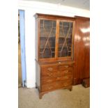 Mahogany glazed bookcase with two short and three long drawers with panel glazed doors above, 97cm