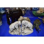 Carved stone elephant together with a pair of elephant book ends and two other elephants