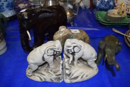 Carved stone elephant together with a pair of elephant book ends and two other elephants