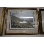 Reproduction print of stags on a mountainside by V Balfour-Browne, framed and glazed